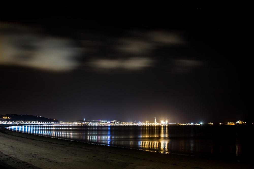 Stargaze on quiet beaches and explore rock pools during a peaceful spring night.