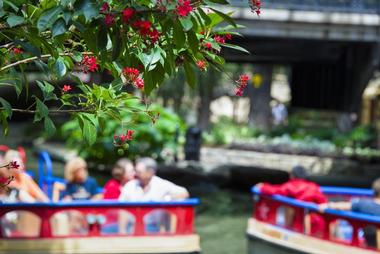 Cruise on the river in one of the colorful barges | Things to Do in San Antonio with Kids