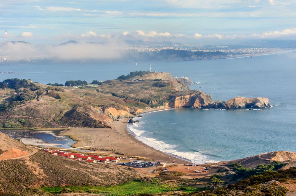 Walk along pebbled shores and explore sights in this quiet, unusual cove.