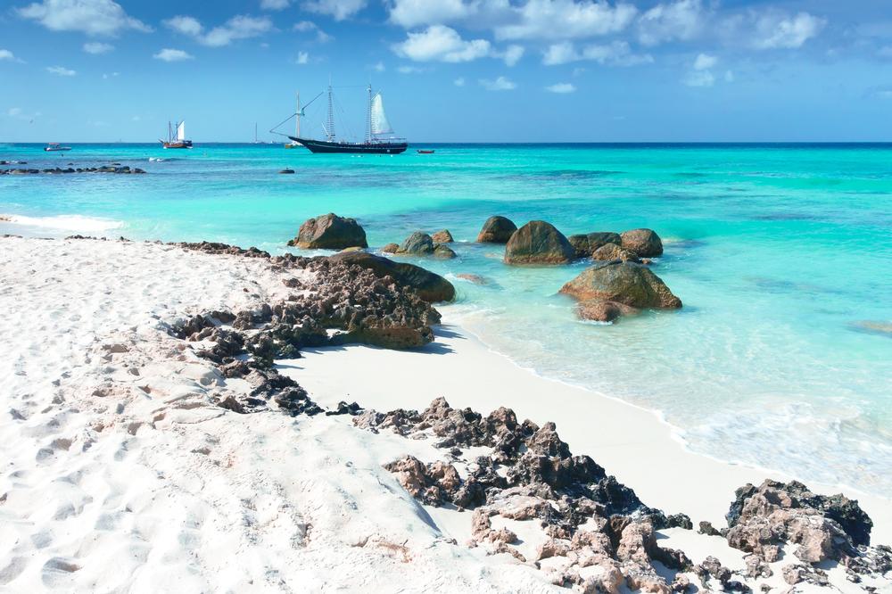 Swim in calm waters and admire stunning sunset views.