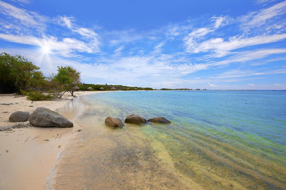 Relax in shallow, crystal-clear waters ideal for kids and families.
