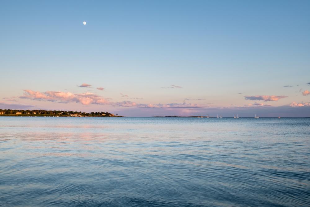 Surf gentle waves and savor fresh seafood nearby.