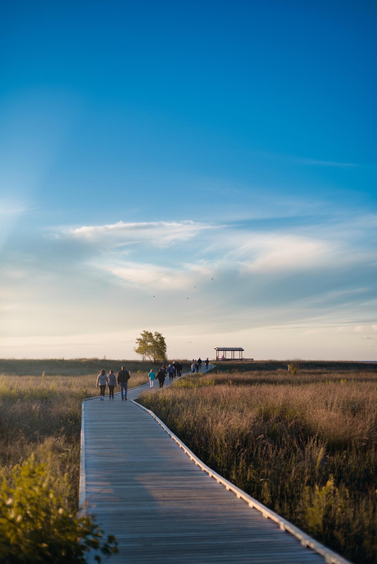 Walking along the boardwalk in Headlands Beach State Park