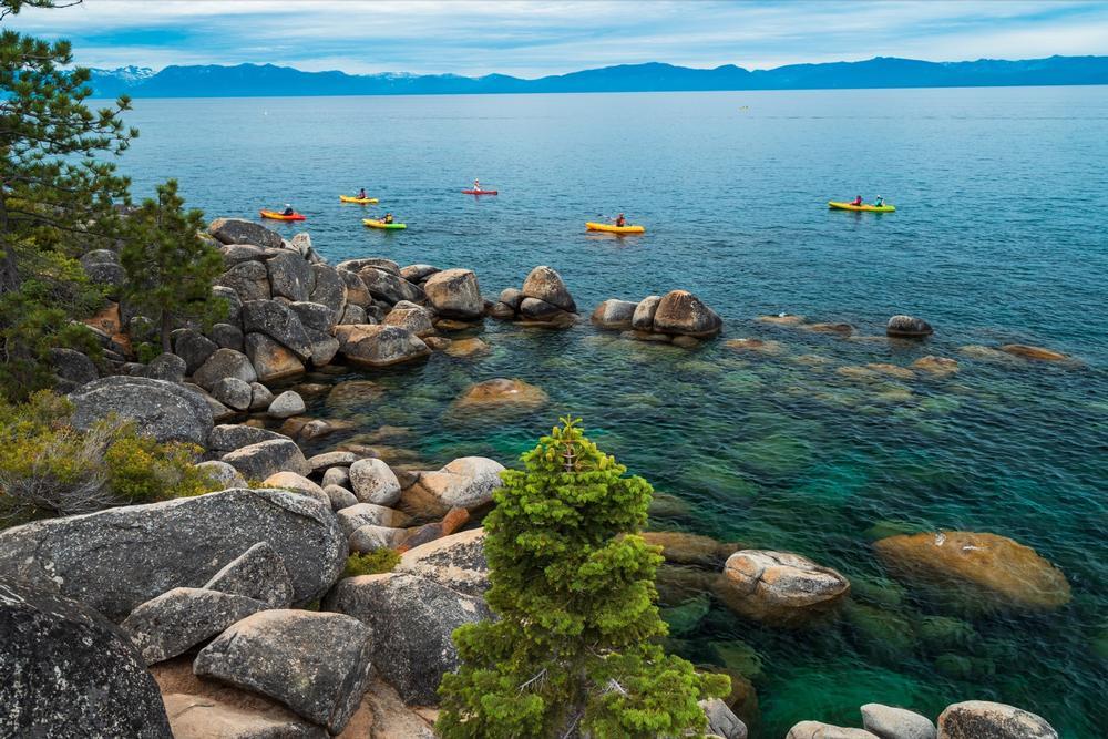 Kayak through crystal-clear waters and enjoy panoramic mountain views.