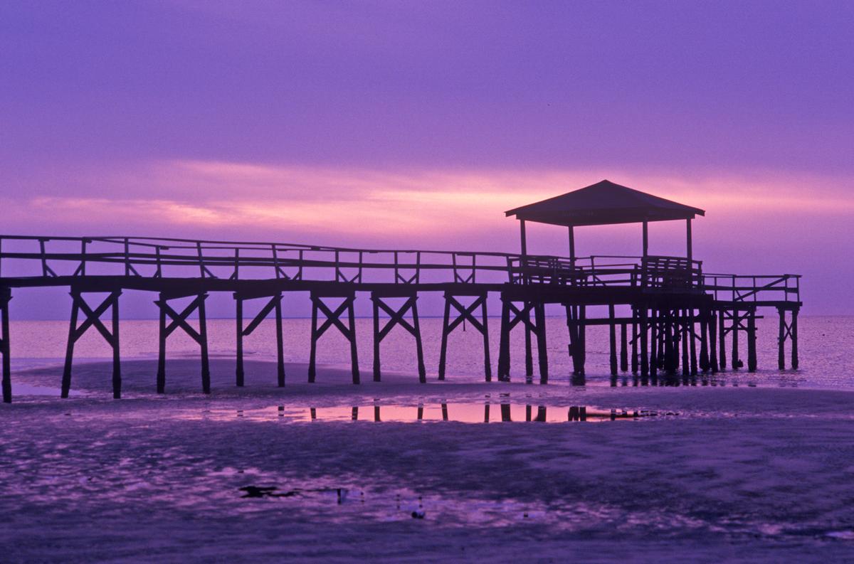 Sunrise over the Gulf of Mexico with pier in Biloxi, MS