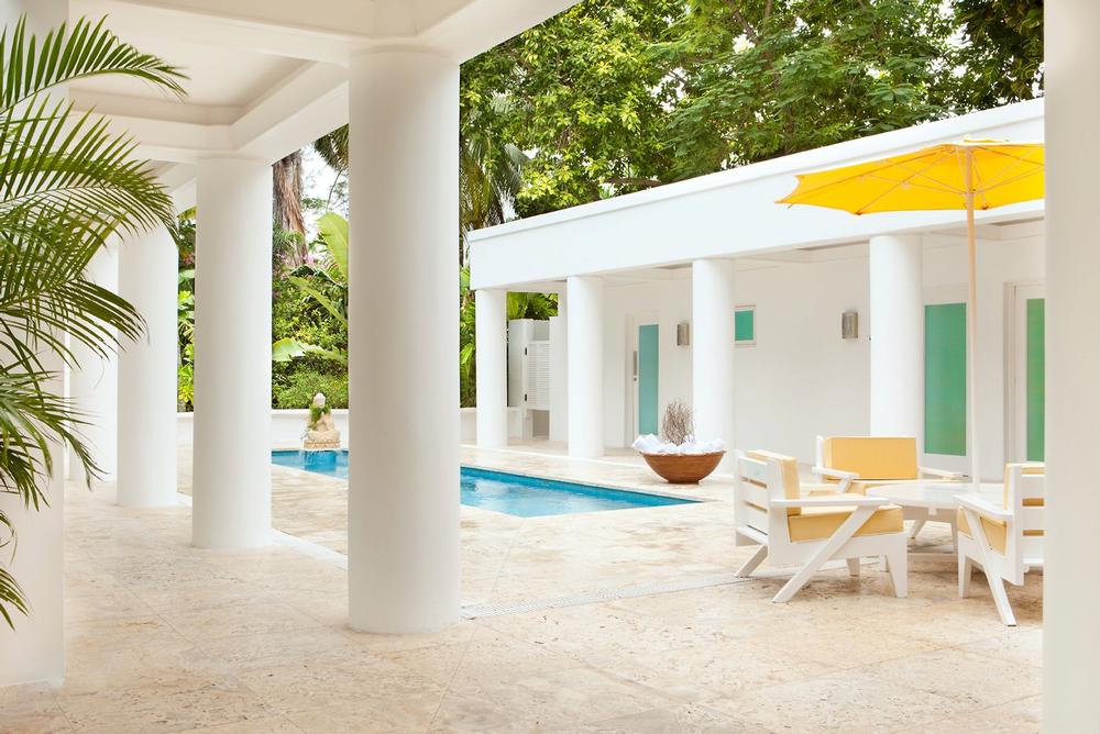 Admire private island views and savor Caribbean flavors in a romantic setting.