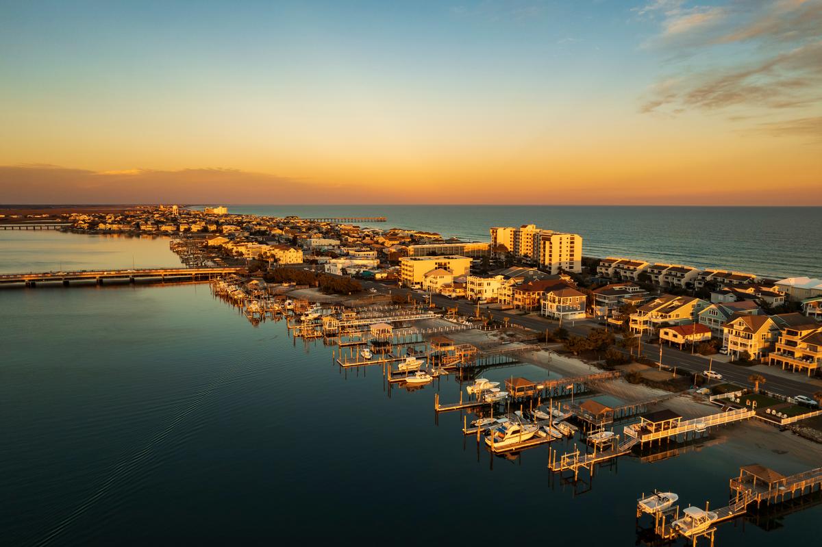Wrightsville Beach with boats and hotels at sunset