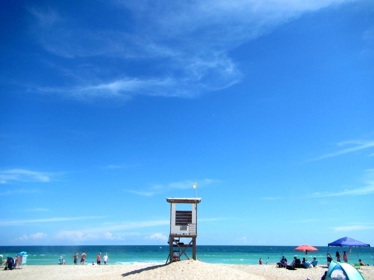 Surf rolling waves and stroll along the scenic boardwalk.