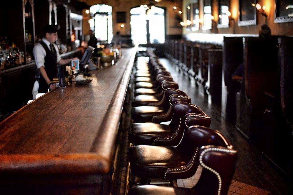 Savor craft cocktails and enjoy historic charm in a lively atmosphere.