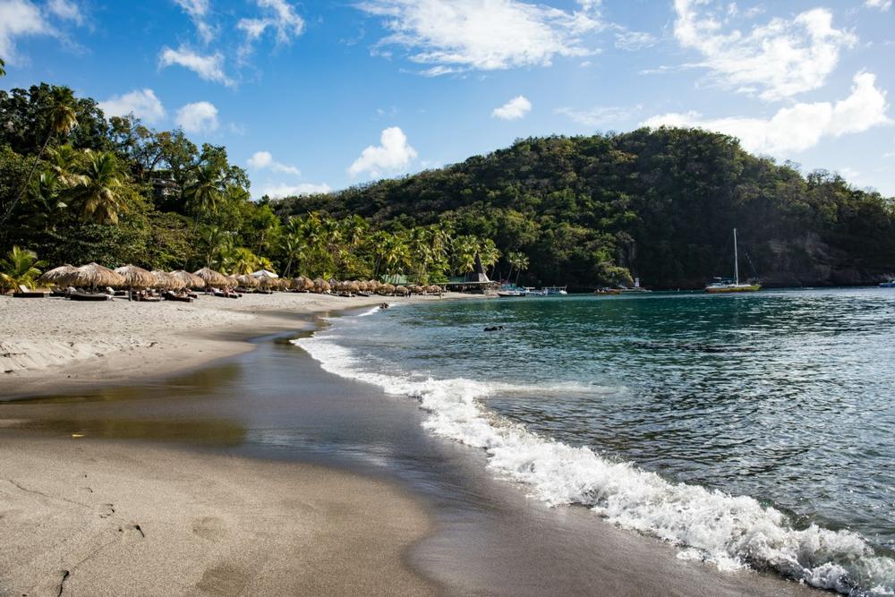 Snorkel in clear waters and admire stunning Piton views.
