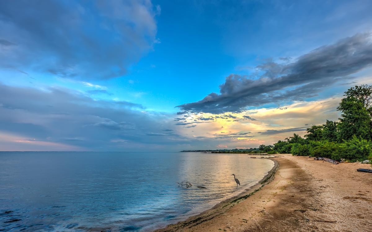 Relax on peaceful shores and enjoy stunning bay views.