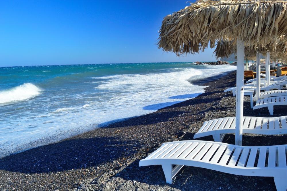 Walk on volcanic sands and enjoy vibrant beachside dining.