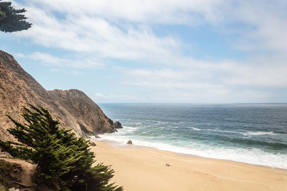 Walk along wide sandy shores and admire rugged coastal cliffs.