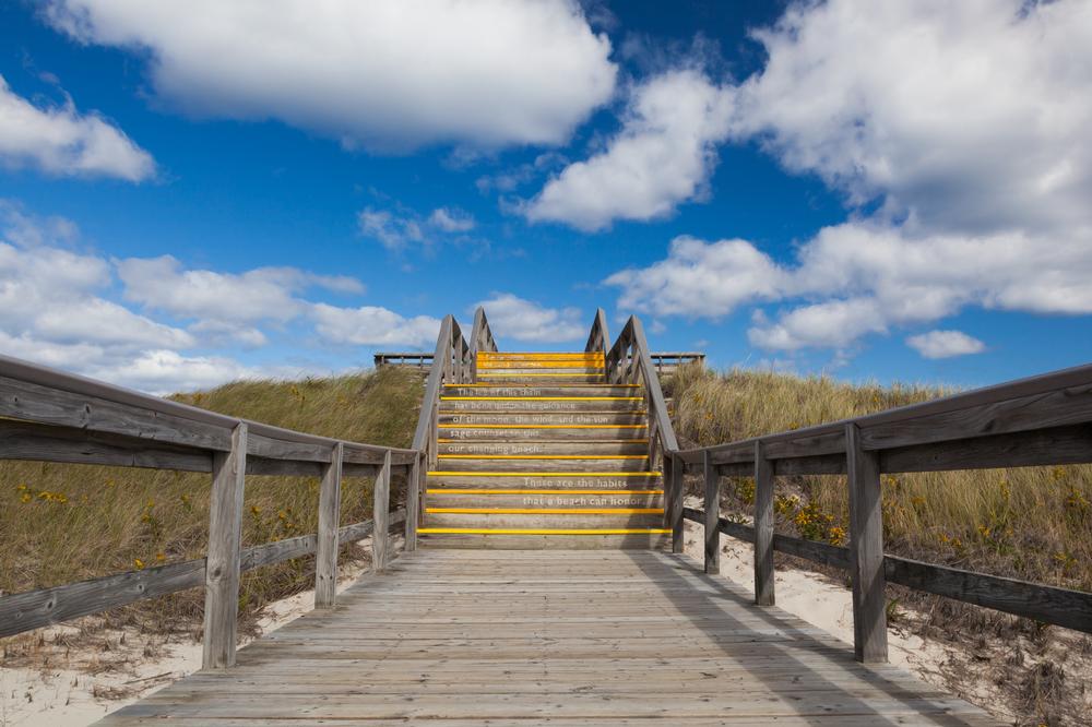 Walk along wide sandy shores and explore scenic dunes.