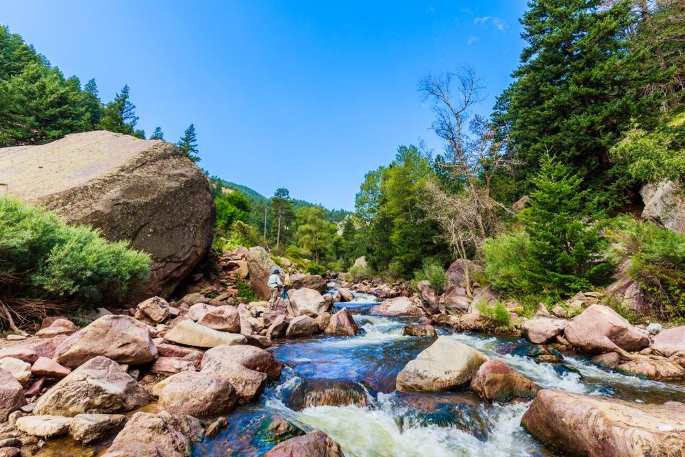 Hike on rugged cliffs and admire canyon views during fall.