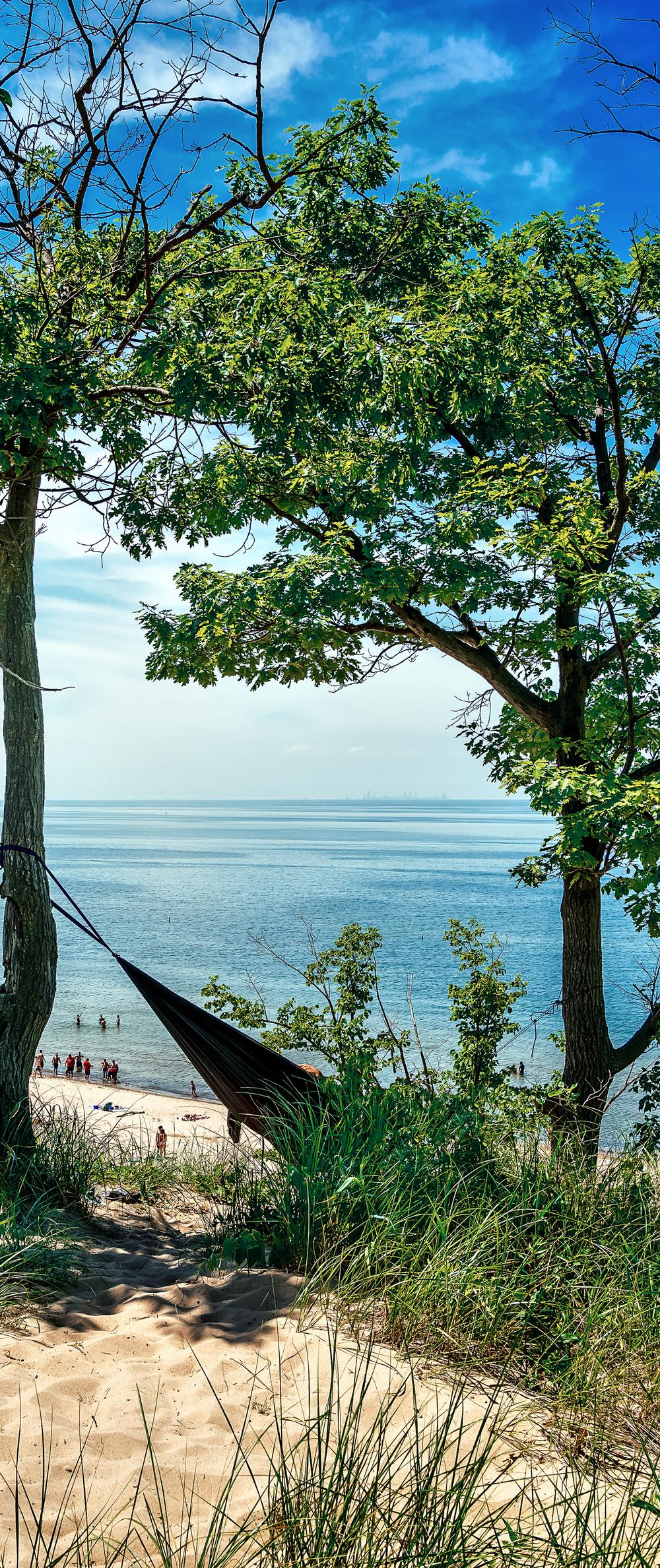 Hike sandy dunes and swim in Lake Michigan during summer.