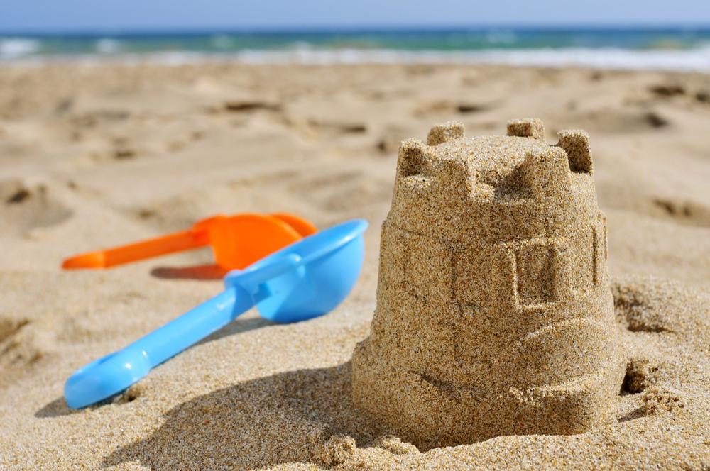 https://stock.adobe.com/gr_en/images/sandcastle-and-toy-shovels-on-the-sand-of-a-beach/74447669