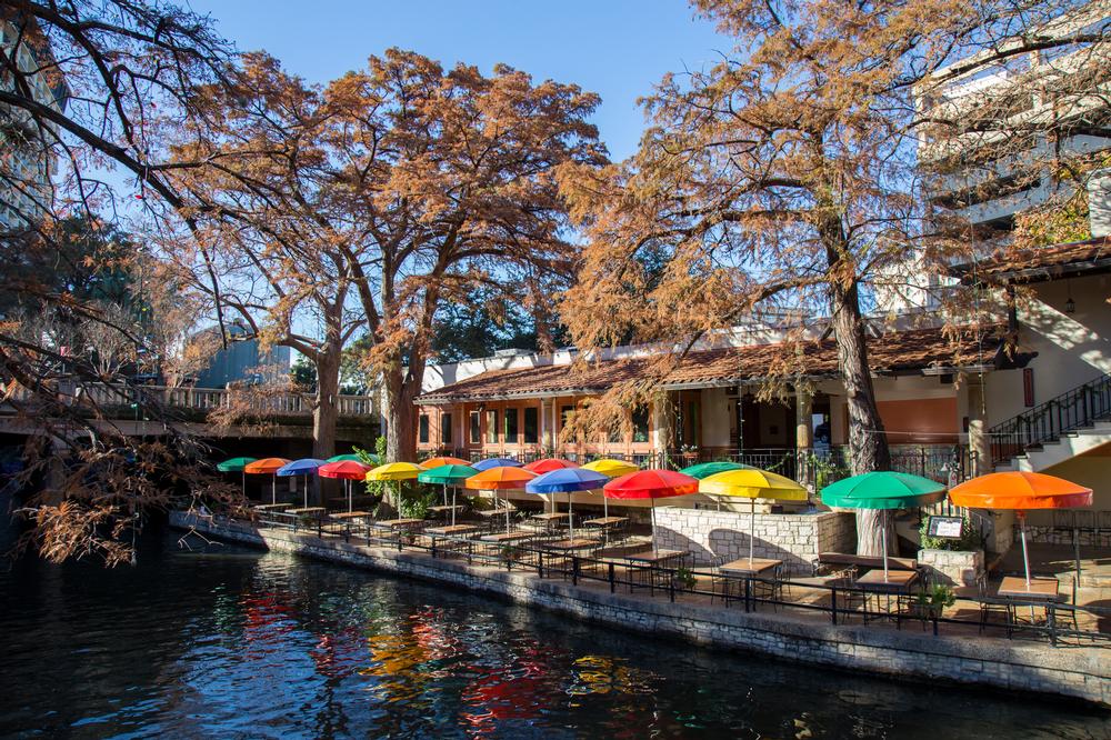 Shops, restaurants, and live music line this lively waterside path through downtown