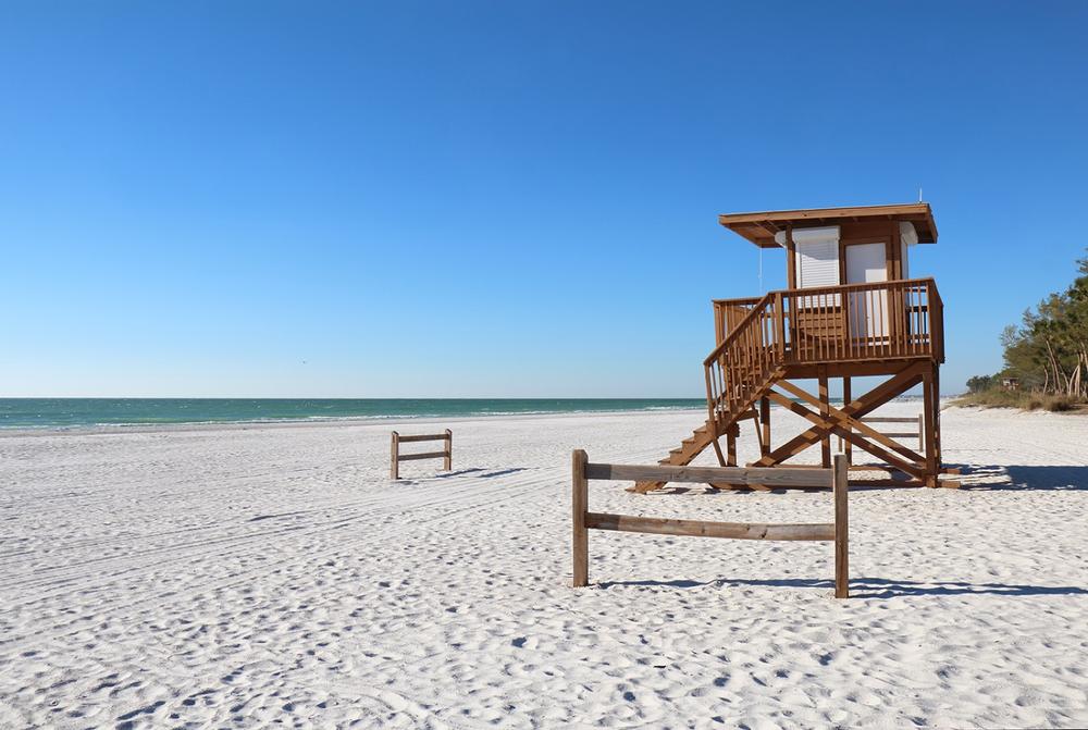 Sunbathe on quiet sands on Anna Maria Beach