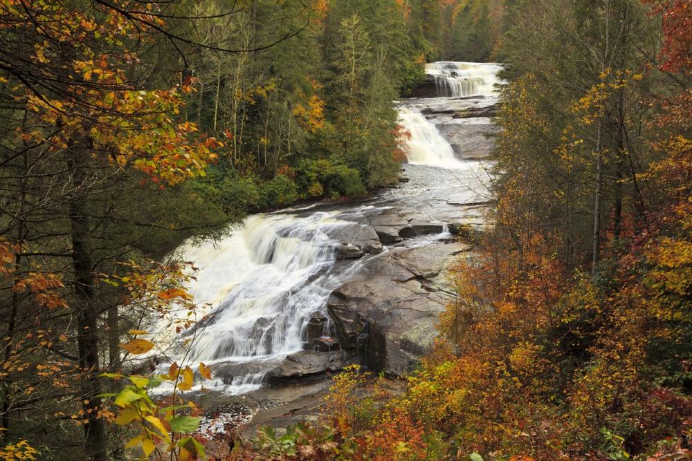 Hike scenic trails and admire stunning waterfalls in North Carolina’s Blue Ridge Mountains.