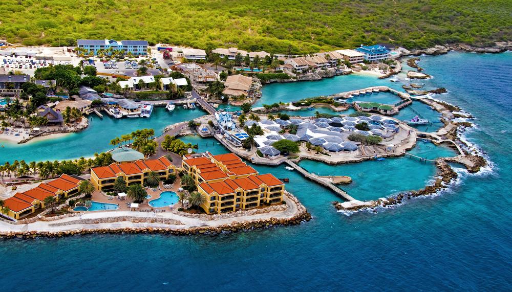 Explore colorful streets and dive offshore reefs on an unusual Caribbean adventure.