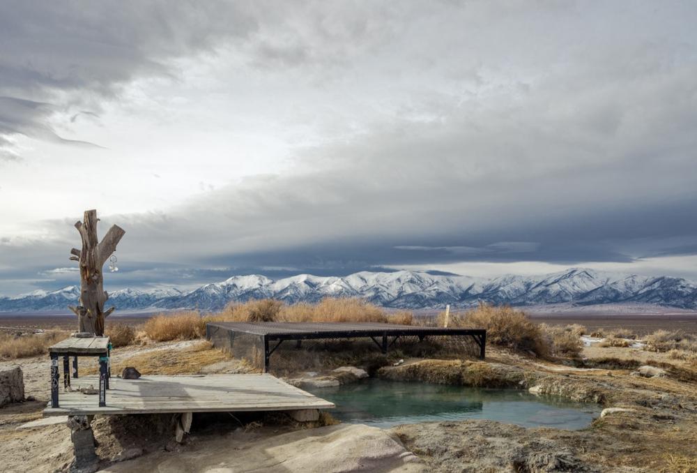 Relax in soothing waters and admire the tranquil desert surroundings for a serene retreat.