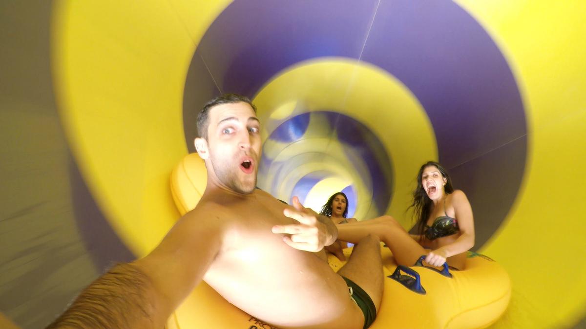 Sliding down in a colorful water slide