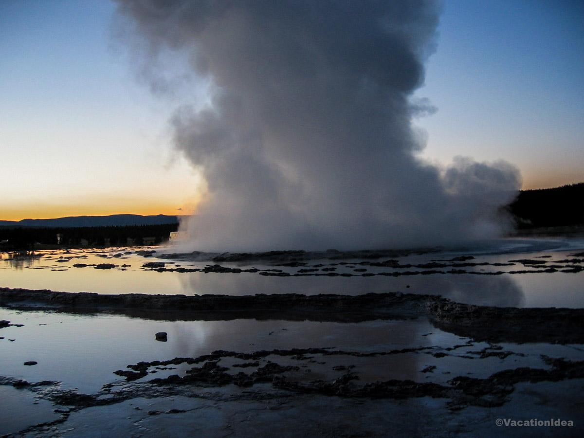 My photo of an erupting geyser in Yellowstone at sunset