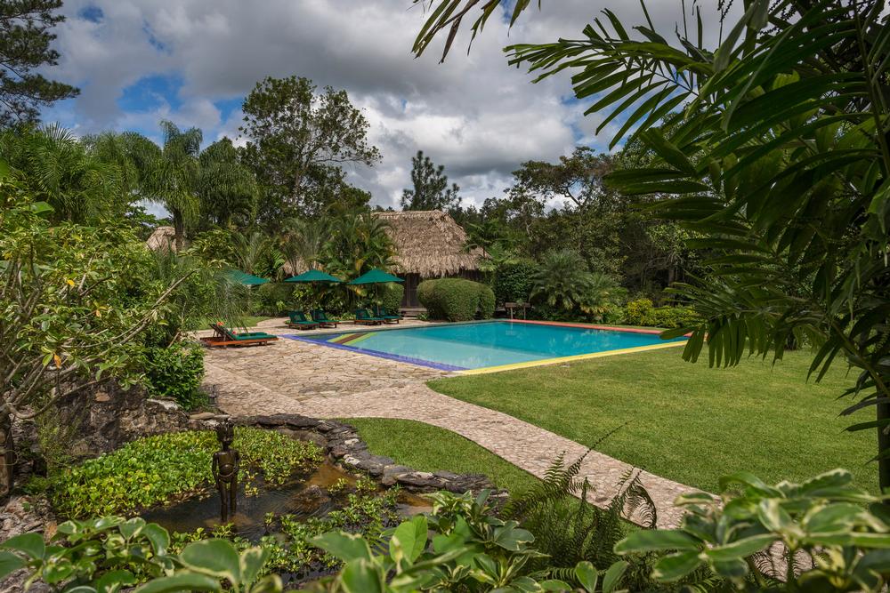 Relax in eco-luxury and explore lush Belizean rainforests.