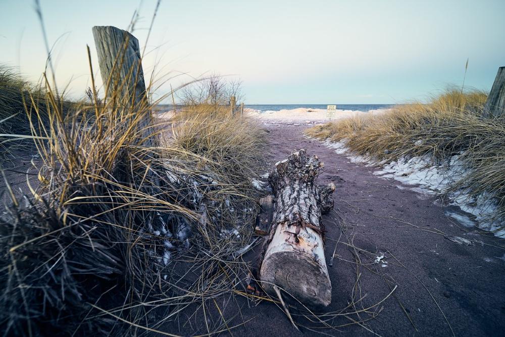 Relax on sandy shores and admire sailboats gliding across Lake Superior.
