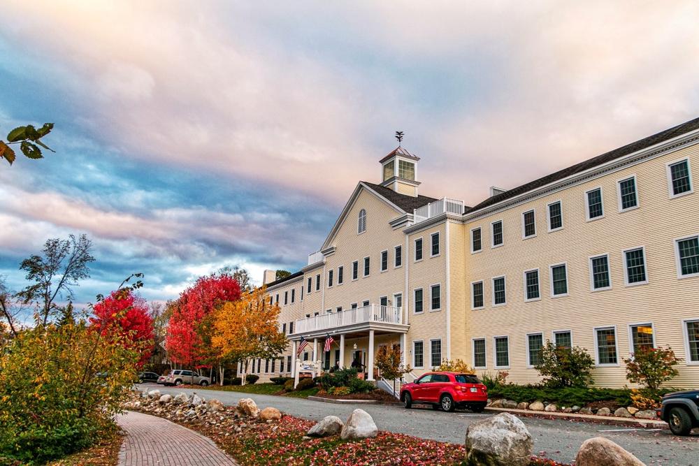 Explore charming shops and admire riverside views in this vibrant New England town.