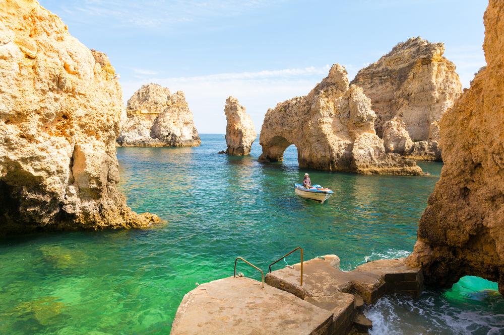 Explore golden cliffs and swim in hidden coves on a romantic summer trip.