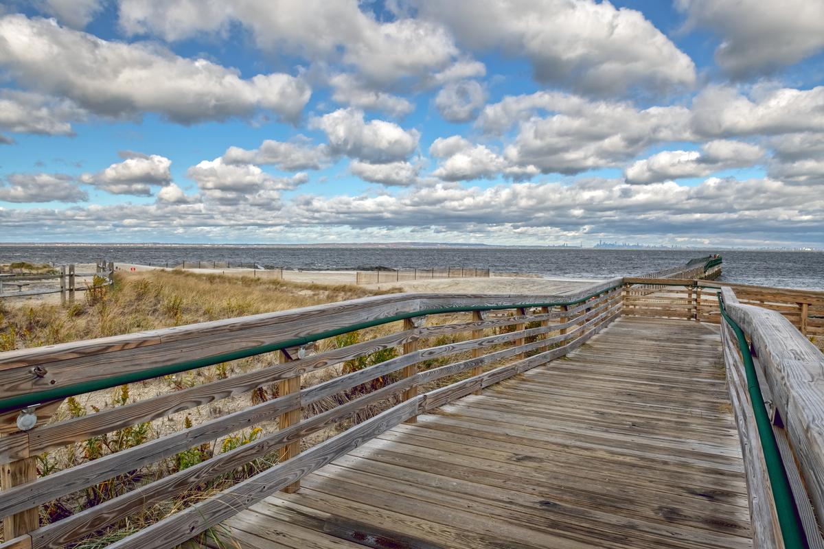 Pier and clouds at Bayshore Waterfront Park
