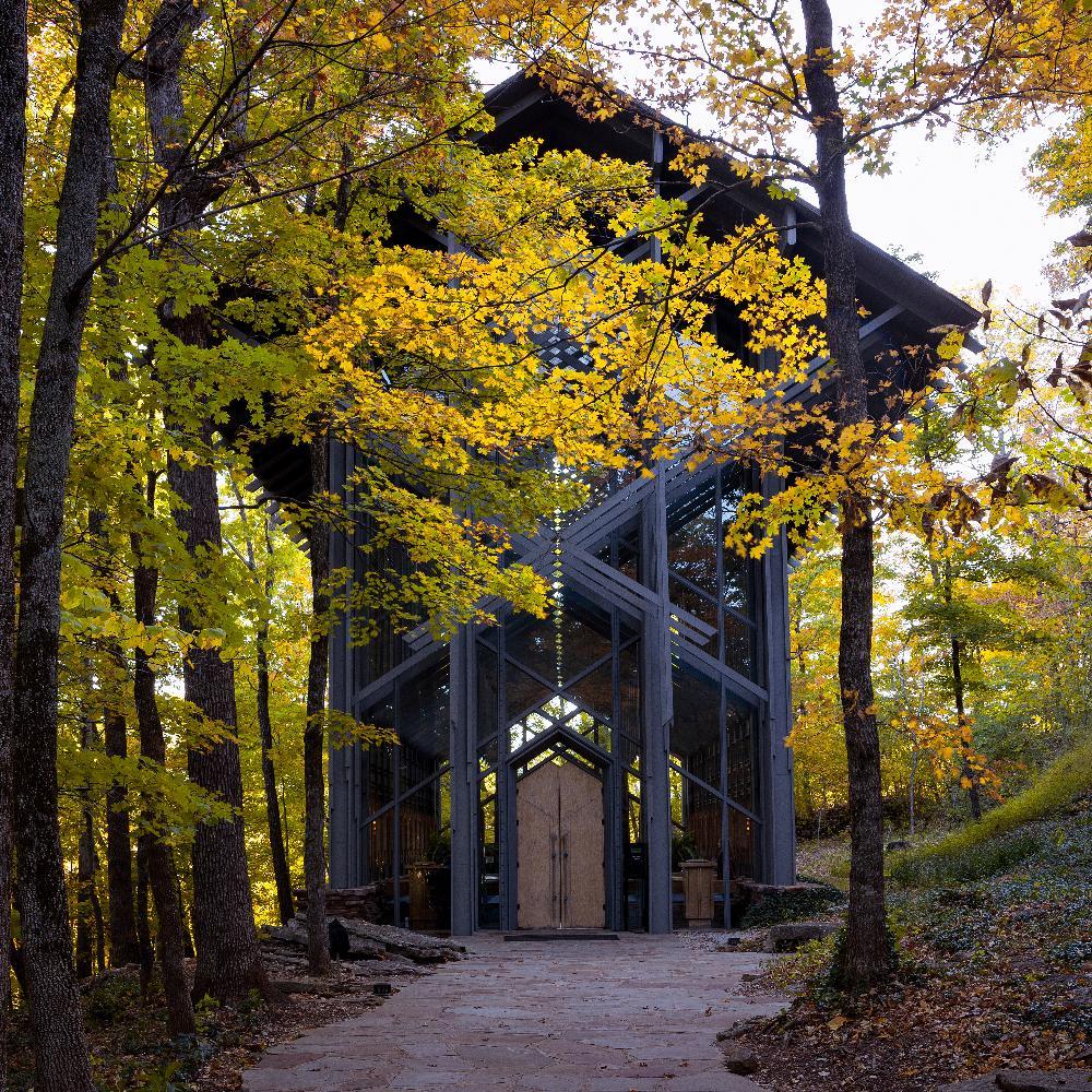 Thorncrown Chapel with leaves starting to turn yellow in the fall