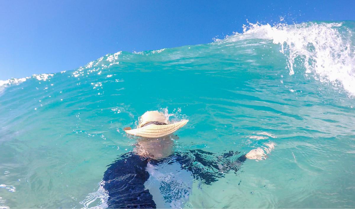 I snapped this photo of a wave rolling towards the shore on West Maui just as my husband dove under it
