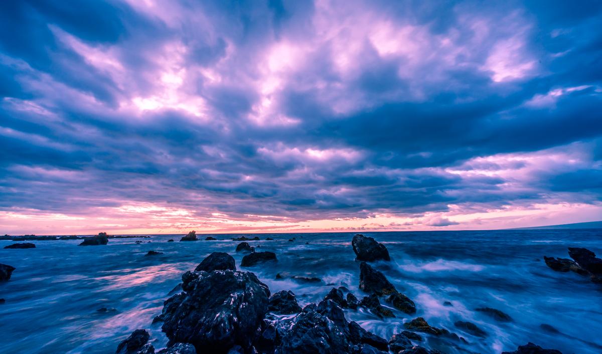 My husband took this photo of a sunset over the rocks one beautiful evening