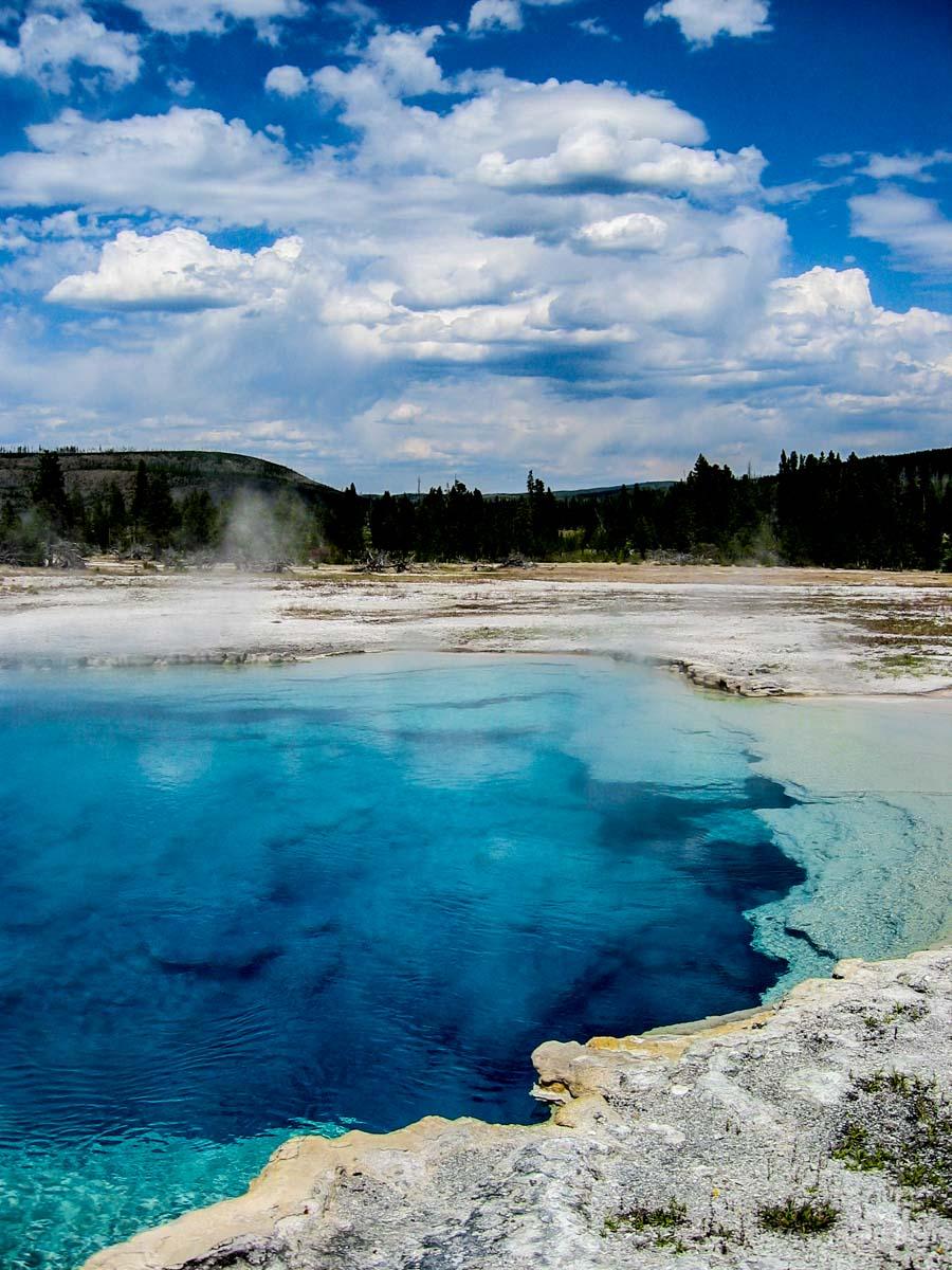 My photo of a bright blue pool in Yellowstone. Remember to Pin it.