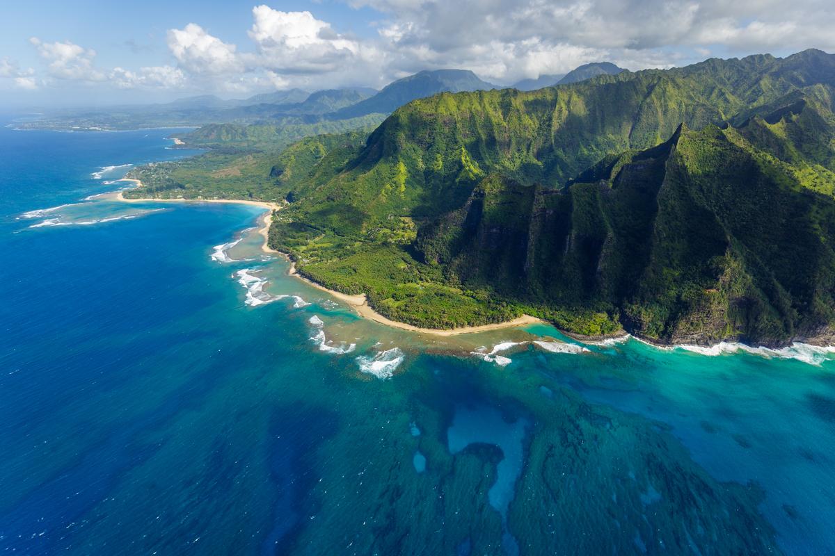 View on the mountains of Kauai's north coast with Kee Beach and the reef from Kailio Point