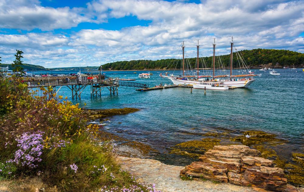 Walk along the shore and enjoy quaint shops on a romantic summer getaway.
