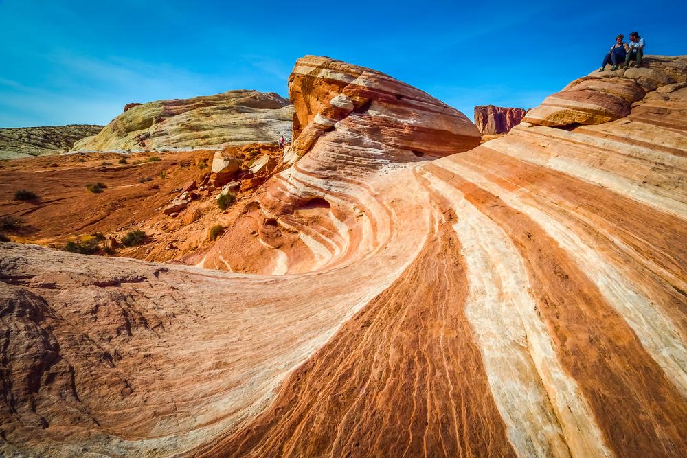 Admire fiery red sandstone and discover ancient petroglyphs on a stunning spring trip.