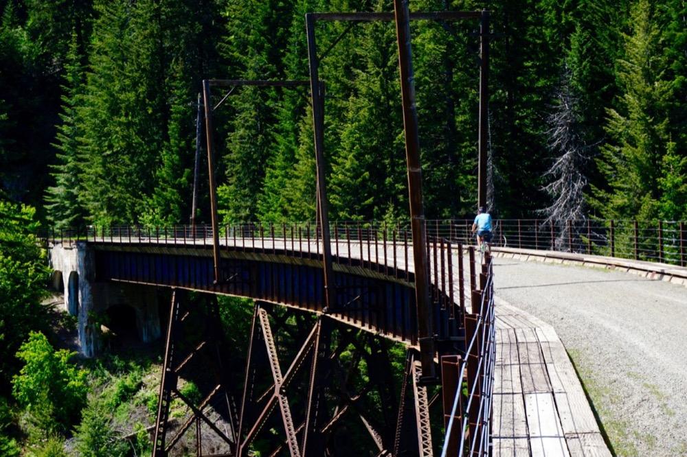 Bike on scenic trestles and ride through tunnels during a summer trip.