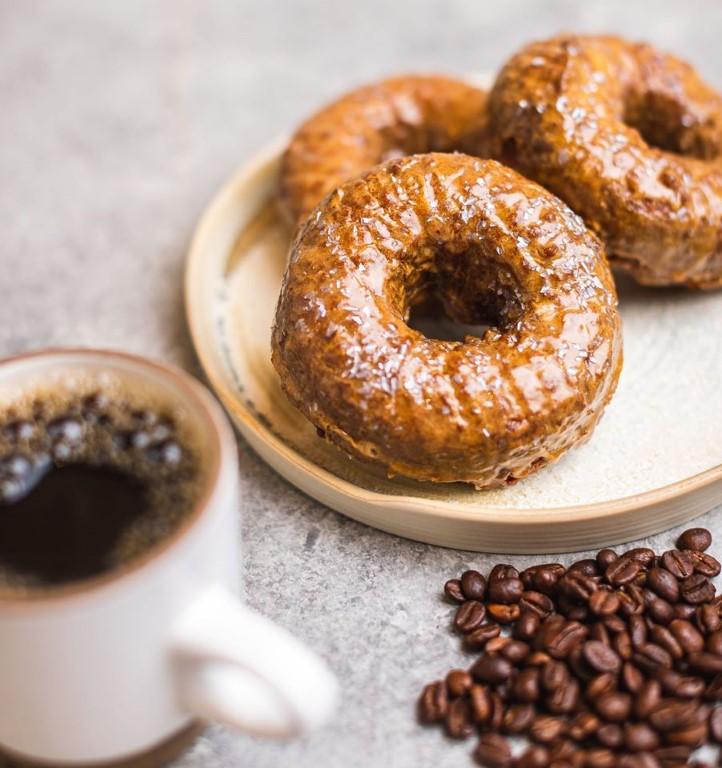 Savor freshly baked gourmet doughnuts and pair them with rich coffee.