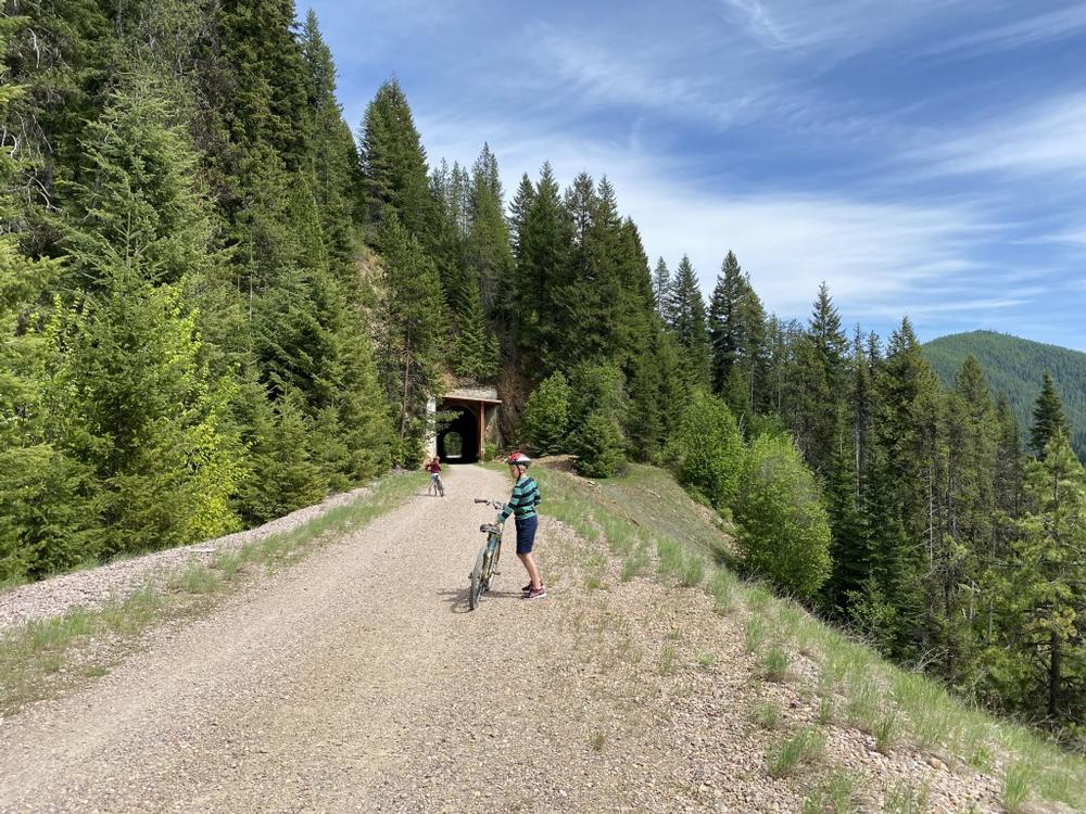 Bike through scenic tunnels along the Route of The Hiawatha Trail