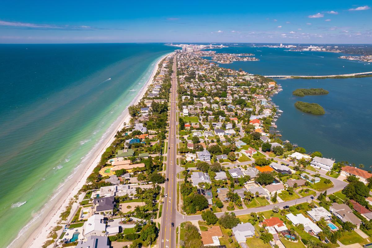 Collect seashells and watch dolphins during a romantic coastal walk.