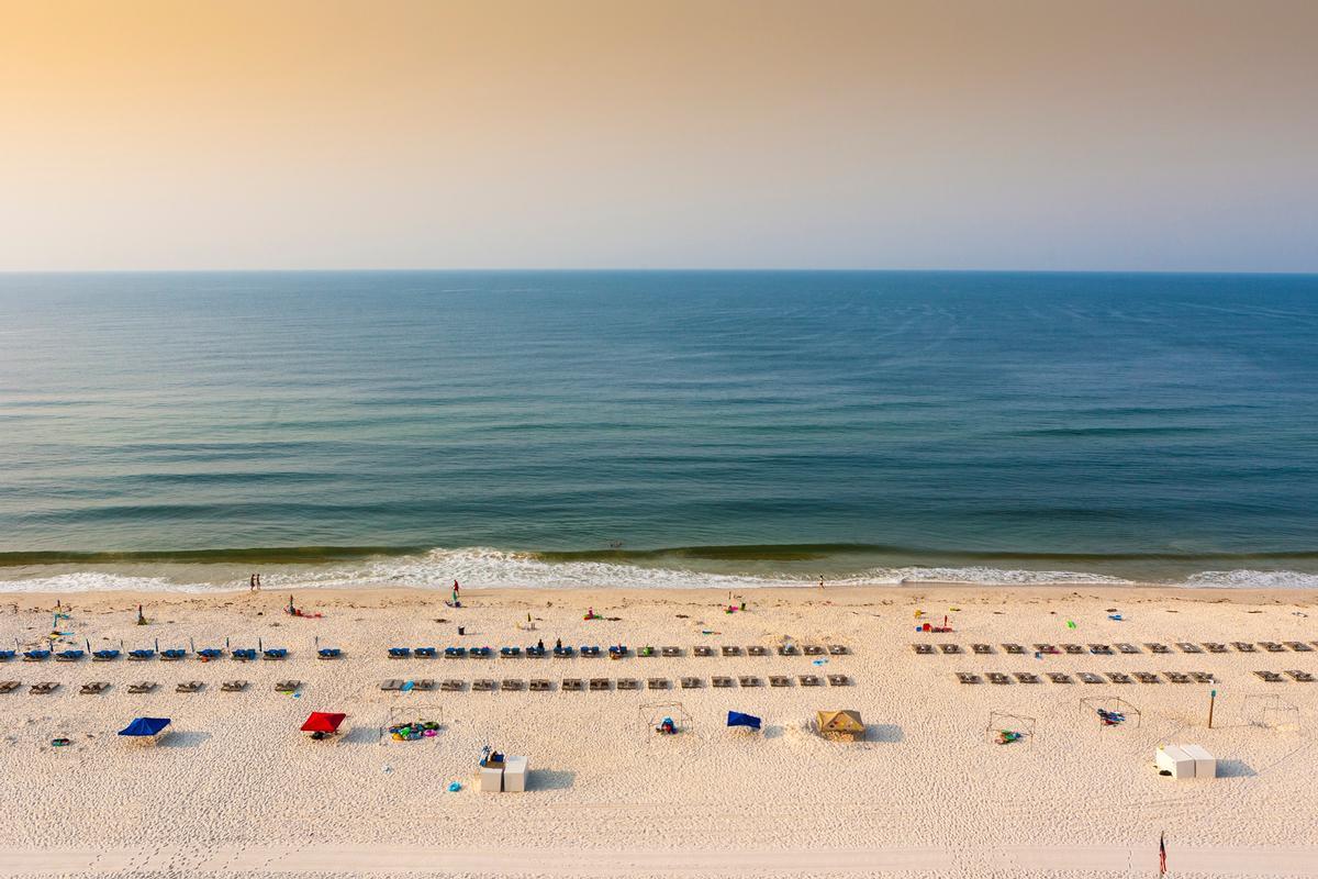 A beach in Gulf Shores Alabama from above at sunrise in early summer