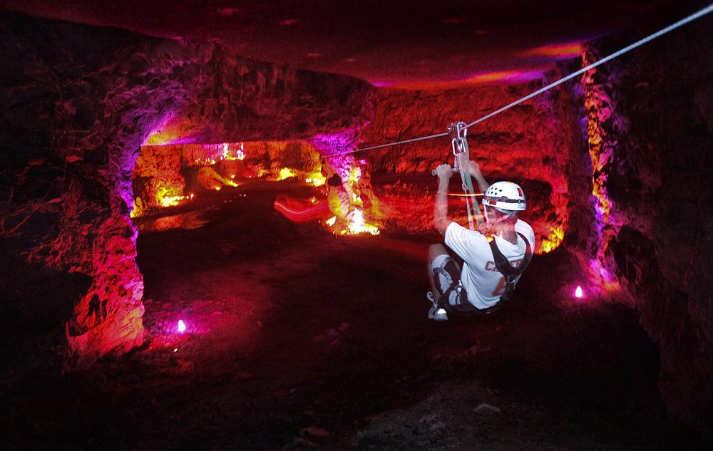 Go ziplining underground or explore massive man-made caves.
