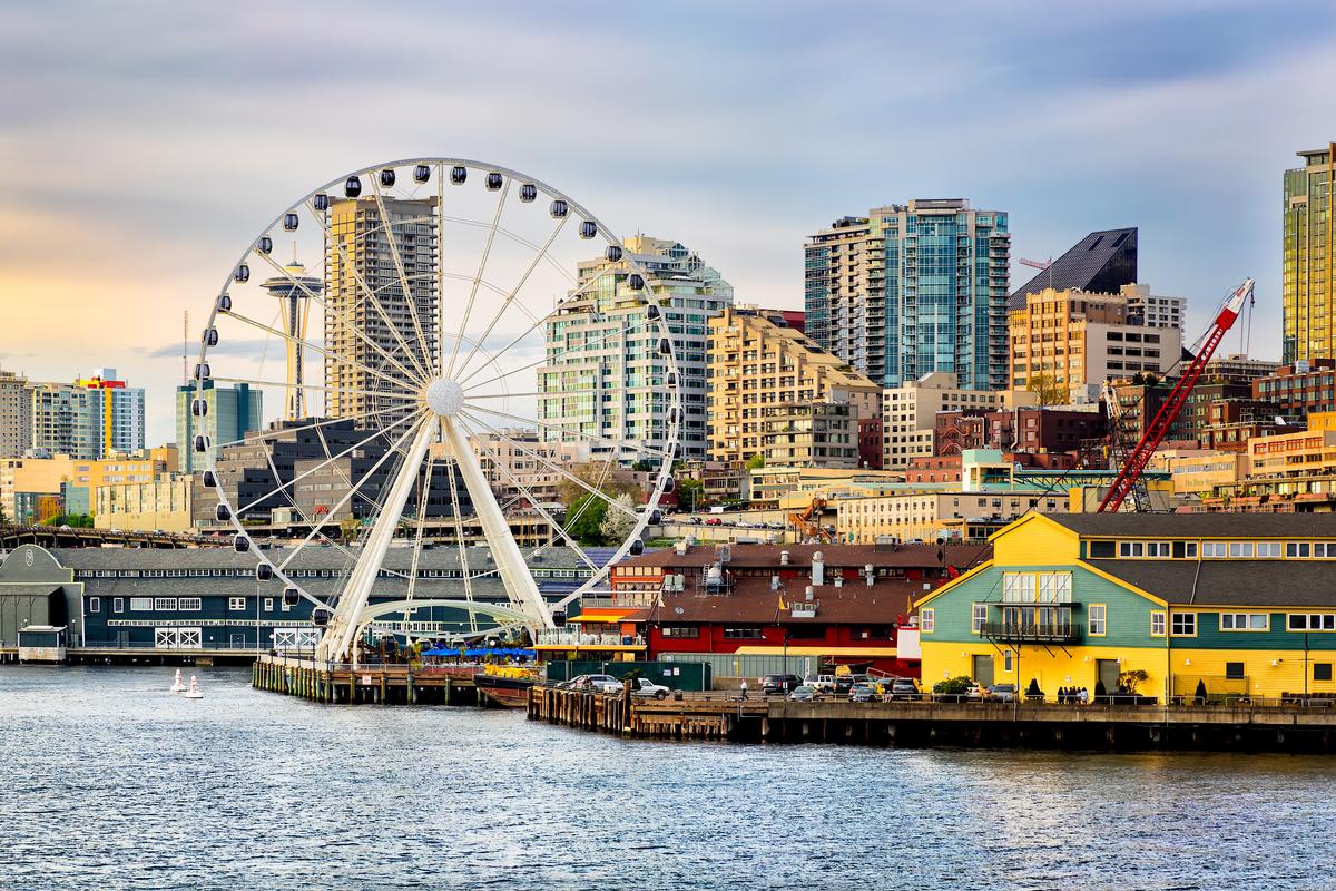 Seattle waterfront and skyline at dusk with golden light