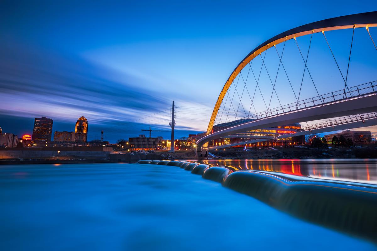 Des Moines River walk bridge reflected in the Des Moines River