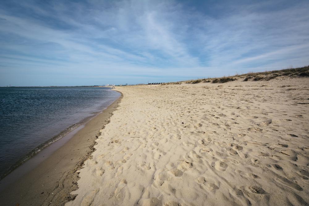 Walk sandy dunes and bike shoreline paths for a romantic coastal experience.