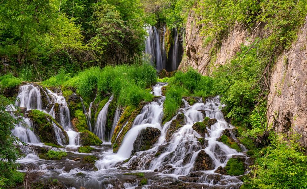 Walk along forest trails and admire cascading waterfalls in this peaceful summer escape.
